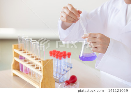 Science school: Students' hands as they study science Science school: Students' hands as they study science 141121039
