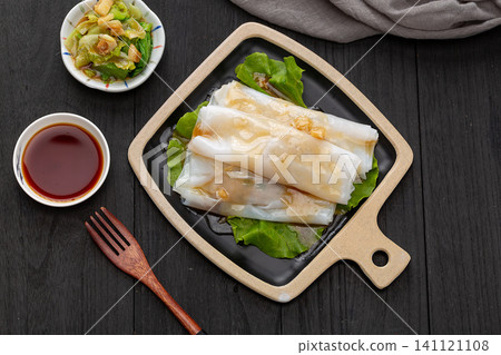 Cantonese dim sum steamed rice noodle rolls with sweet soy sauce and lettuce Cantonese dim sum steamed rice noodle rolls with sweet soy sauce and lettuce 141121108