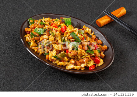 stir-fried scrambled eggs with fermented soybeans and chopped chili peppers, traditional Chinese Hunan cuisine. stir-fried scrambled eggs with fermented soybeans and chopped chili peppers, traditional Chinese Hunan cuisine. 141121139