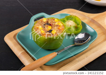 healthy delicious stuffed sweet peppers with savory rice filling, close up. healthy delicious stuffed sweet peppers with savory rice filling, close up. 141121152