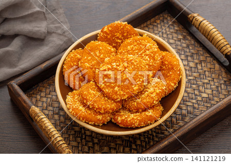 authentic Chinese Nanguabing, fried sticky rice pumpkin cakes with breadcrumbs. authentic Chinese Nanguabing, fried sticky rice pumpkin cakes with breadcrumbs. 141121219