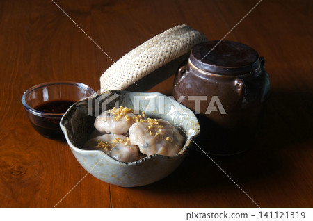 A delicious and artfully presented steamed baby bamboo dumplings A delicious and artfully presented steamed baby bamboo dumplings 141121319