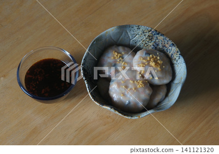 A delicious and artfully presented steamed baby bamboo dumplings A delicious and artfully presented steamed baby bamboo dumplings 141121320
