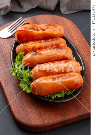 grilled Taiwanese Style Premium Pork Sausages on Plate with Wooden Board grilled Taiwanese Style Premium Pork Sausages on Plate with Wooden Board 141122473
