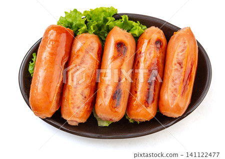 grilled Taiwanese Style Premium Pork Sausages on black Plate ,Isolated White Background grilled Taiwanese Style Premium Pork Sausages on black Plate ,Isolated White Background 141122477