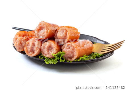 grilled Taiwanese Style Premium Pork Sausages on black Plate ,Isolated White Background grilled Taiwanese Style Premium Pork Sausages on black Plate ,Isolated White Background 141122482