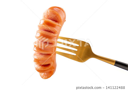 close-up of Juicy Grilled Spiral Cut Pork Sausage on Gold Fork Isolated on White Background close-up of Juicy Grilled Spiral Cut Pork Sausage on Gold Fork Isolated on White Background 141122488