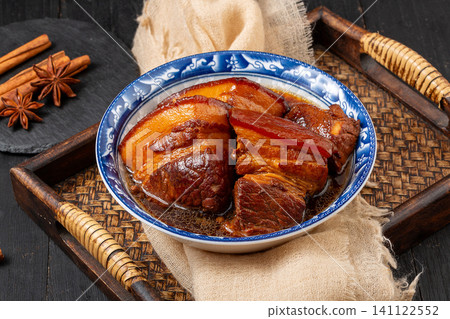 traditional Chinese Braised Pork Belly served in Ceramic Bowl on Wooden Tray traditional Chinese Braised Pork Belly served in Ceramic Bowl on Wooden Tray 141122552