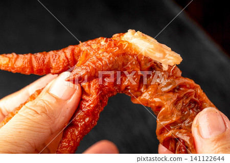 close up Spicy Braised Chicken Foot Hot Chili Marinated Poultry Claw Dim Sum Snack close up Spicy Braised Chicken Foot Hot Chili Marinated Poultry Claw Dim Sum Snack 141122644