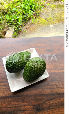 Avocado on a white plate Avocado on a white plate 141122751