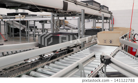 packing line in a logistics warehouse. conveyor belt in a modern production line. Pallet racking 141122788