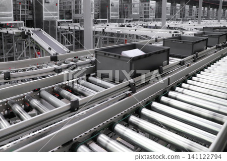 packing line in a logistics warehouse. conveyor belt in a modern production line. Pallet racking 141122794