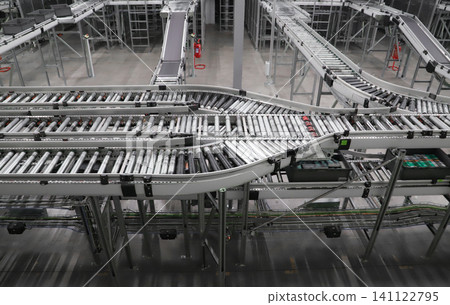 packing line in a logistics warehouse. conveyor belt in a modern production line. Pallet racking 141122795