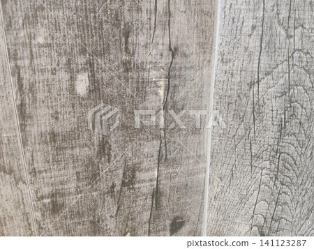 A weathered gray wood grain background A weathered gray wood grain background 141123287