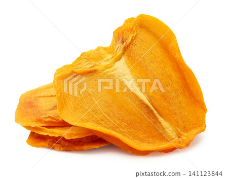 Pieces of dried persimmon close-up on a white background. Isolated Pieces of dried persimmon close-up on a white background. Isolated 141123844