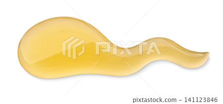 Honey dripping close-up on a white background. Isolated 141123846