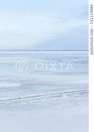 A tranquil, minimalist winter landscape with frozen sea A tranquil, minimalist winter landscape with frozen sea 141124066