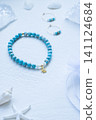 Turquoise and mother-of-pearl accessories: bracelet, earrings, and star charm. 141124684