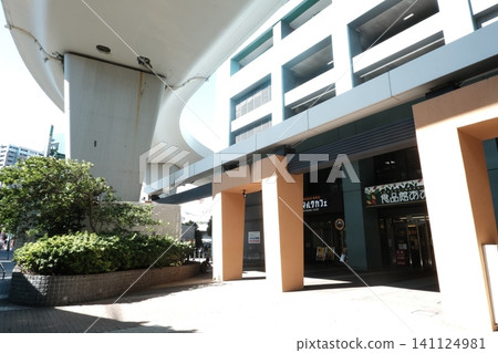 Commercial facilities beneath modern architecture: Cafe and shop entrance Commercial facilities beneath modern architecture: Cafe and shop entrance 141124981