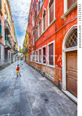 Amazing cityscape of Venice with narrow canals, boats and gondolas and bridges with traditional buildings. Amazing cityscape of Venice with narrow canals, boats and gondolas and bridges with traditional buildings. 141125633