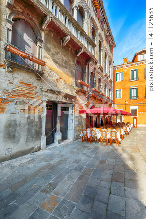 Amazing cityscape of Venice with narrow canals, boats and gondolas and bridges with traditional buildings. Amazing cityscape of Venice with narrow canals, boats and gondolas and bridges with traditional buildings. 141125635