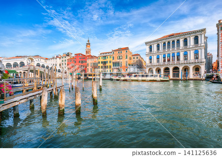 Amazing morning cityscape of Venice with famous Canal Grande and colorful view of Rialto Bridge Amazing morning cityscape of Venice with famous Canal Grande and colorful view of Rialto Bridge 141125636