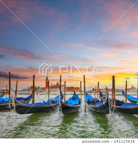 Amazing landscape with Church of San Giorgio Maggiore and gondolas parked beside the Riva degli Schiavoni in Venice Amazing landscape with Church of San Giorgio Maggiore and gondolas parked beside the Riva degli Schiavoni in Venice 141125638