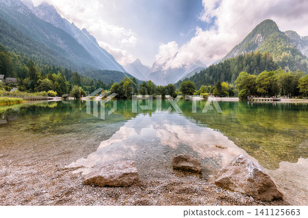 Gorgeous landscape on Jasna lake with beautiful reflections of the mountains. Gorgeous landscape on Jasna lake with beautiful reflections of the mountains. 141125663