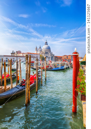 Remarkable morning cityscape of Venice with famous Canal Grande and Basilica di Santa Maria della Salute church. Remarkable morning cityscape of Venice with famous Canal Grande and Basilica di Santa Maria della Salute church. 141125667
