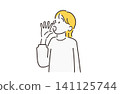 A woman speaking in a loud voice, wearing yellow. 141125744