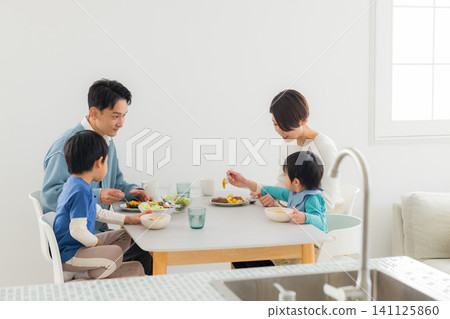 Family eating at the dining table Family eating at the dining table 141125860
