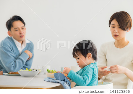 Family eating at the dining table Family eating at the dining table 141125866