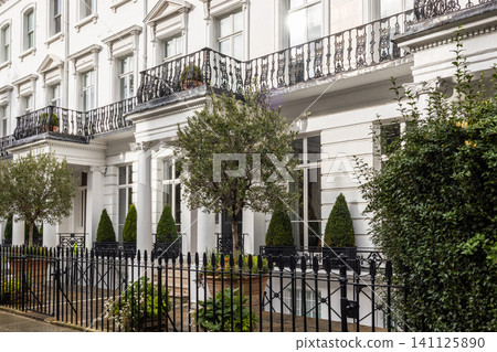 Townhouse facade with wrought iron fence Townhouse facade with wrought iron fence 141125890