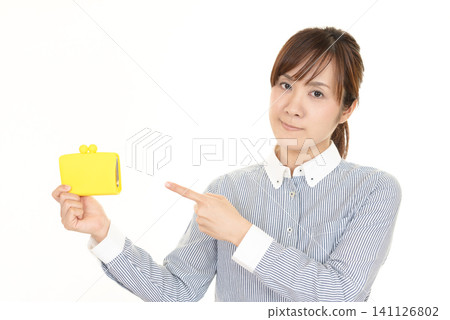 A woman with a wallet A woman with a wallet 141126802