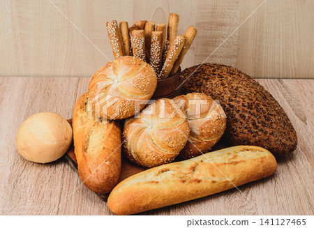 French baguettes. Fresh crispbread. Bread background. French baguettes. Fresh crispbread. Bread background. 141127465
