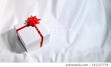gift box with red ribbon gift box with red ribbon 141127774