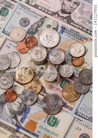 Paper US dollar bills of various denominations and cent coins as a business tool. Cash US dollars Paper US dollar bills of various denominations and cent coins as a business tool. Cash US dollars 141127955
