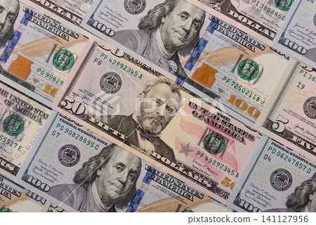 Paper US dollar bills of various denominations and cent coins as a business tool. Cash US dollars Paper US dollar bills of various denominations and cent coins as a business tool. Cash US dollars 141127956