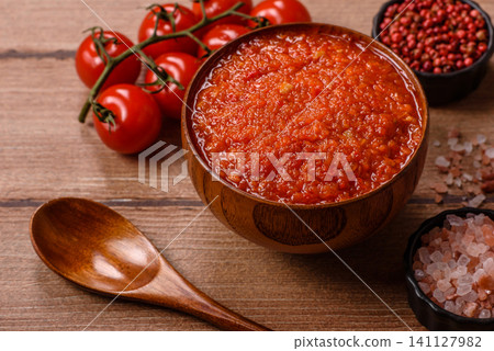 Red tomato Bolognese sauce with spices, salt, pepper, and herbs. A red sauce Red tomato Bolognese sauce with spices, salt, pepper, and herbs. A red sauce 141127982