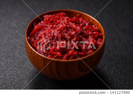 Grated beetroot with salt and spices as an ingredient for borscht or a vegan salad. Grated beetroot 141127990
