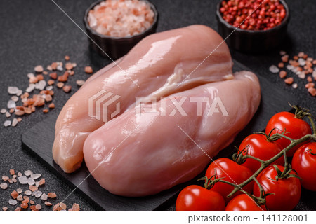 Fresh raw chicken fillet with salt and spices for home cooking. Raw chicken fillet Fresh raw chicken fillet with salt and spices for home cooking. Raw chicken fillet 141128001
