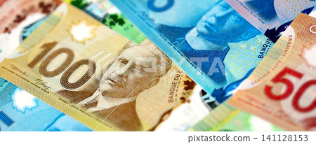 Canadian Dollar currency money bills. CAD currency banknotes in big amount with different denomination close up Canadian Dollar currency money bills. CAD currency banknotes in big amount with different denomination close up 141128153
