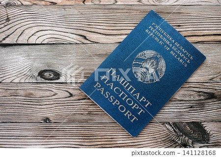 Belarusian passport on table close up. Official identification document book for citizens of Belarus. Concept of travel and tourism in Belarus Belarusian passport on table close up. Official identification document book for citizens of Belarus. Concept of travel and tourism in Belarus 141128168