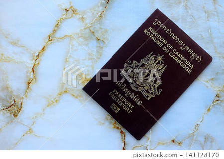 Cambodian passport on table close up. Official identification document book for citizens of Cambodia. Concept of travel and tourism in Cambodia 141128170