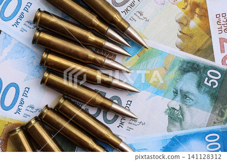 Israel New Shekels banknotes and bullets. The current Israel money bills and ammo Israel New Shekels banknotes and bullets. The current Israel money bills and ammo 141128312