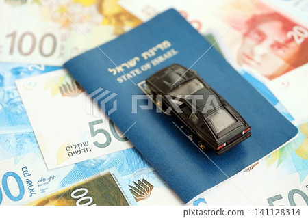Israel New Shekels banknotes and bullets with passport. The current Israel money bills and black car Israel New Shekels banknotes and bullets with passport. The current Israel money bills and black car 141128314