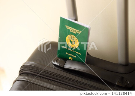 Nigerian passport on travel luggage. The concept of travel and vacation Nigerian passport on travel luggage. The concept of travel and vacation 141128414