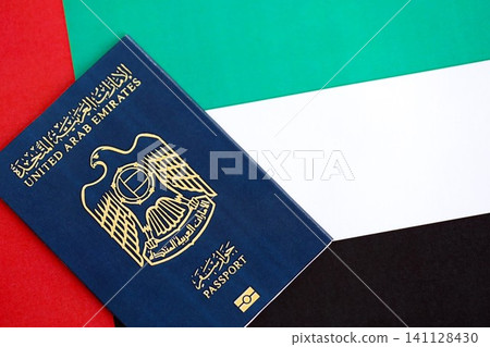 United Arab Emirates passport on flag. The concept of citizenship United Arab Emirates passport on flag. The concept of citizenship 141128430