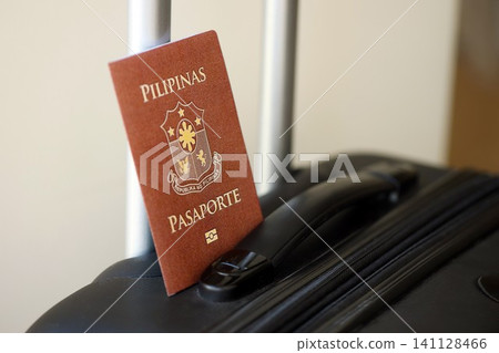 Philippines passport on travel luggage. The concept of travel and vacation Philippines passport on travel luggage. The concept of travel and vacation 141128466