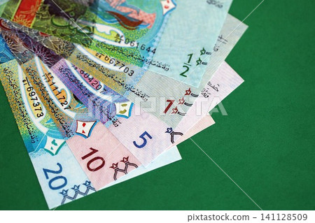 Kuwaiti dinar money bills in big amount on green. Finance and banking concept 141128509